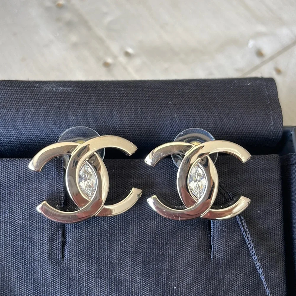 Chanel oversize gold logo earrings with crystal center with box